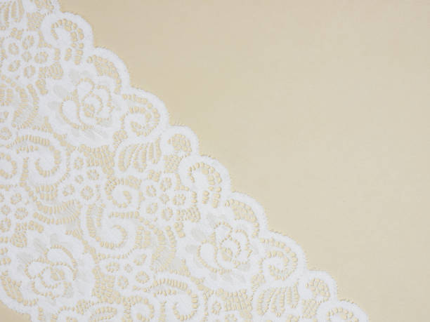 istock White laces on a beige background diagonally in row 1146240480