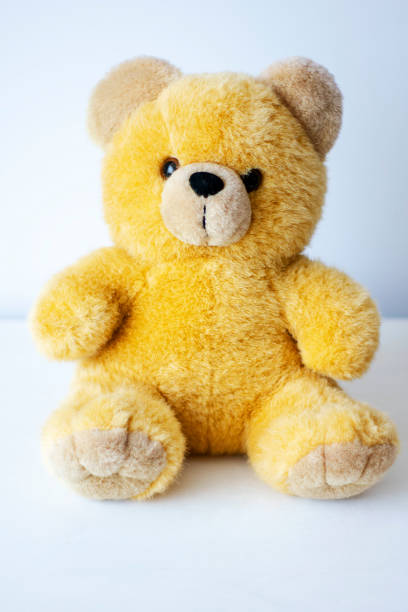 istock brown toy soft bear on white background childhood concept 1146240582