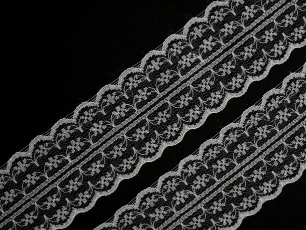 istock White laces on a black background diagonally in two row 1146241285