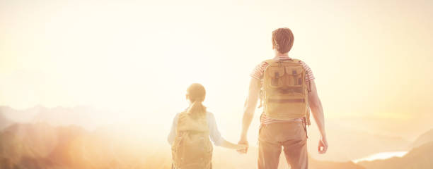 istock happy family at sunset. 1146241464