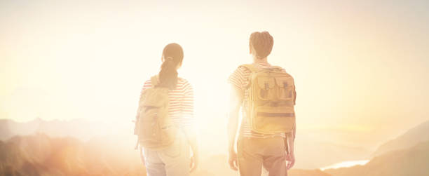 istock Couple looks at sunset. 1146241496