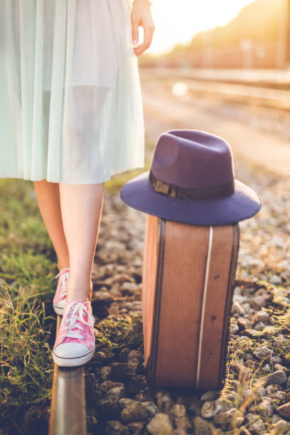 Young girl walks the train stripe