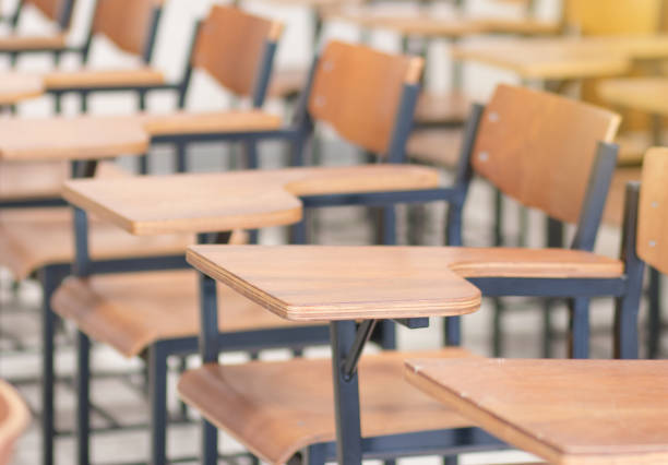 istock Chair in empty classroom, lecture chairs in school 1146241646