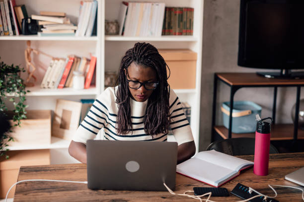 istock African woman working in a modern co-working space 1146241715