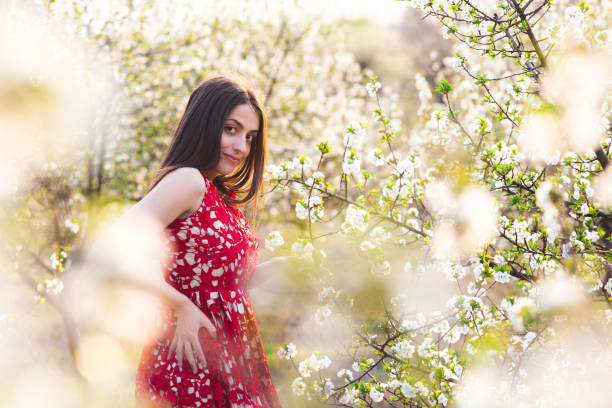 istock Romantic portrait in blooming trees 1146241927
