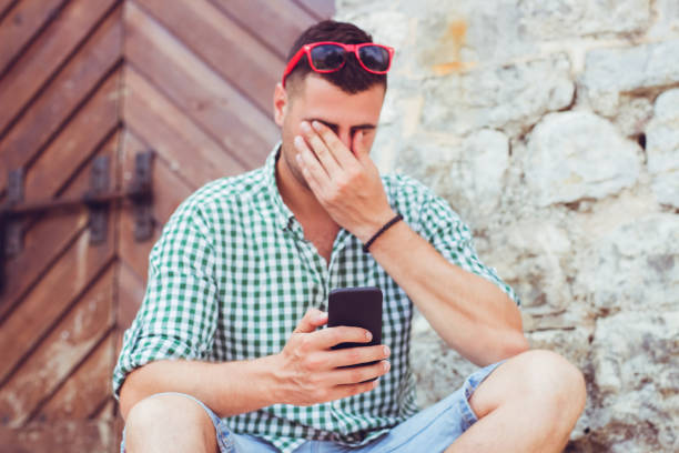istock A tired young man with a mobile phone in Budva Montenegro. 1146242960