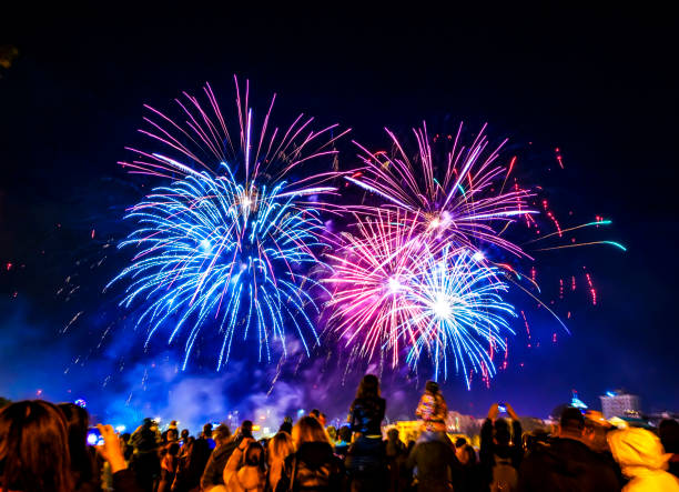 istock Five big fireworks on dark city sky 1146243033