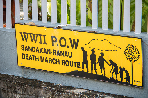 The sign outside the Sandakan Memorial Park noting it's historical significance as a WWII POW camp and part of the Sandakan-Ranau death march route.