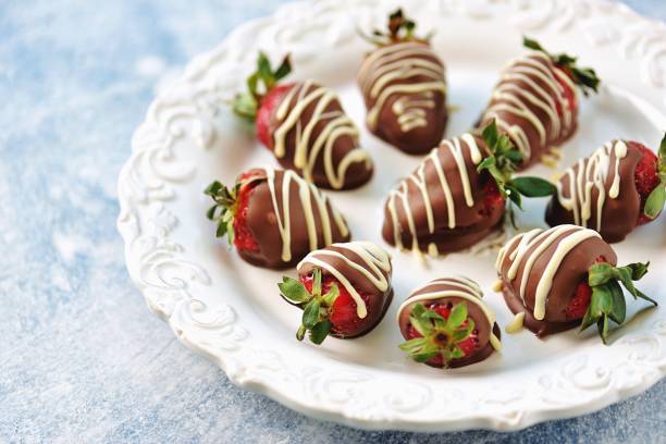 istock Delicious fresh strawberries in milk and white chocolate. 1146244216