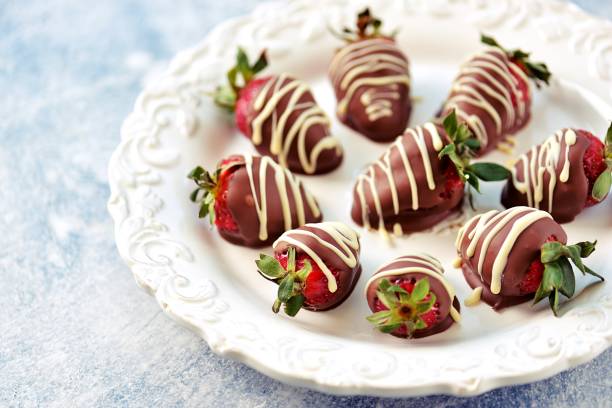 istock Delicious fresh strawberries in milk and white chocolate. 1146244220