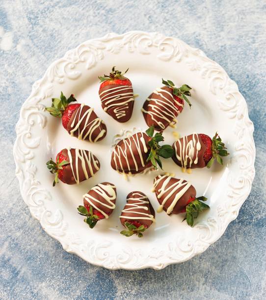 istock Delicious fresh strawberries in milk and white chocolate. 1146244234