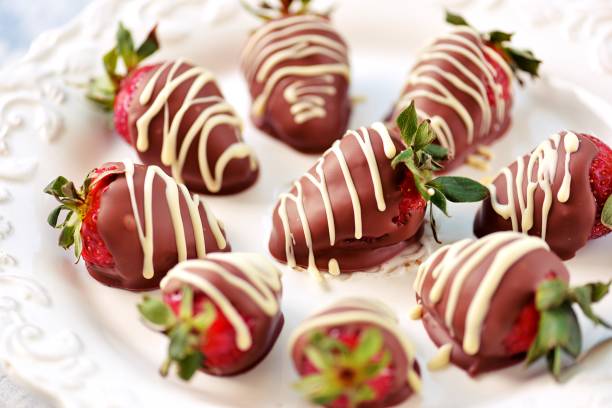 istock Delicious fresh strawberries in milk and white chocolate. 1146244238