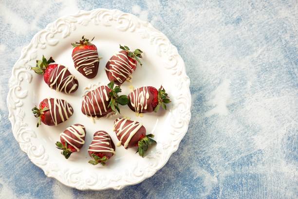 istock Delicious fresh strawberries in milk and white chocolate. 1146244301