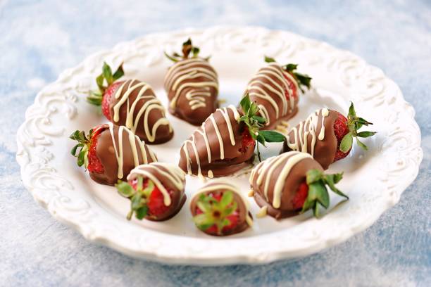 istock Delicious fresh strawberries in milk and white chocolate. 1146244302
