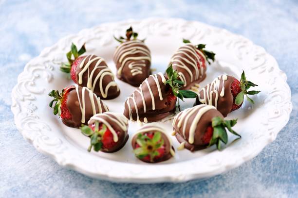 istock Delicious fresh strawberries in milk and white chocolate. 1146244305