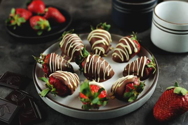 istock Delicious fresh strawberries in milk and white chocolate. 1146244355