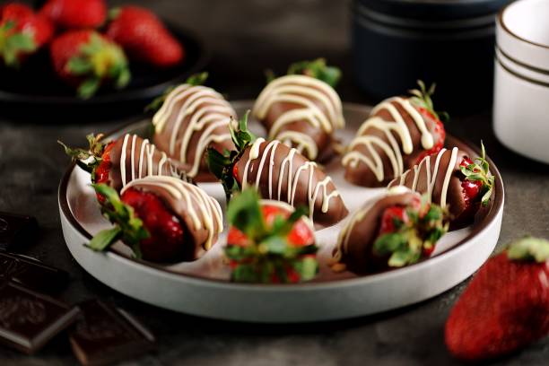 istock Delicious fresh strawberries in milk and white chocolate. 1146244377