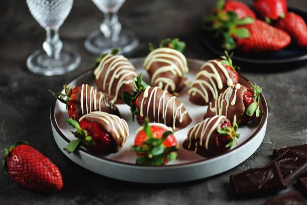 Delicious fresh strawberries in milk and white chocolate. stock photo