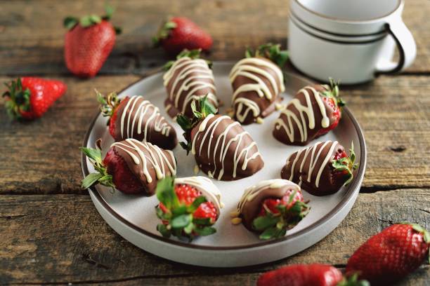 istock Delicious fresh strawberries in milk and white chocolate. 1146244396