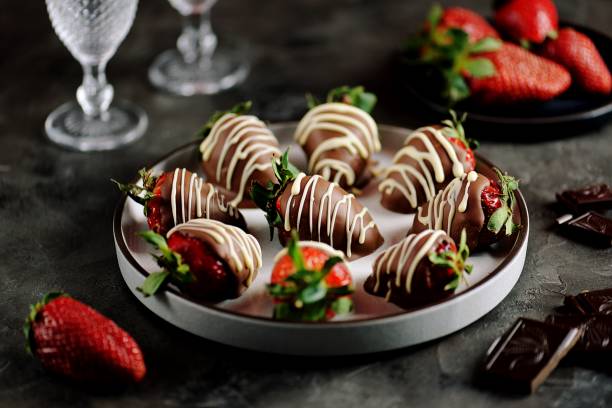 istock Delicious fresh strawberries in milk and white chocolate. 1146244404