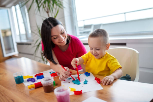 istock mother and son playing plasticine 1146245224
