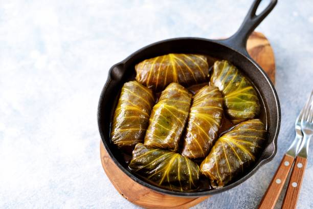 istock Cabbage leaves stuffed with rice, minced meat in tomato sauce. 1146245284