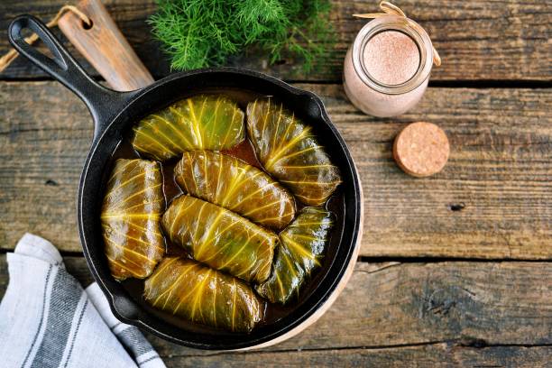 istock Cabbage leaves stuffed with rice, minced meat in tomato sauce. 1146245286
