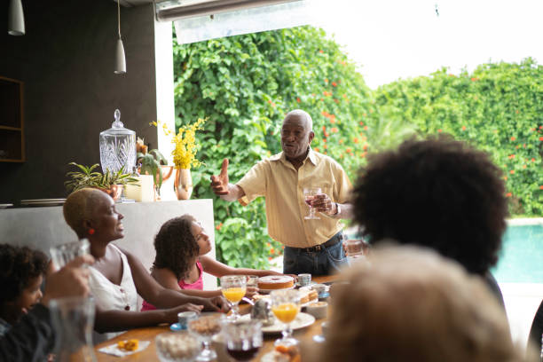 istock Grandfather makes a speech at family breakfast 1146245707