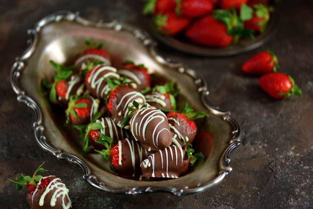 istock Delicious fresh strawberries in milk and white chocolate. 1146246349