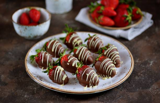 istock Delicious fresh strawberries in milk and white chocolate. 1146246387