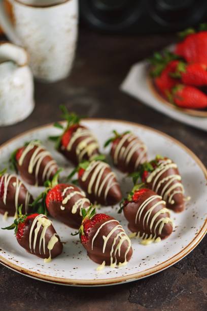 istock Delicious fresh strawberries in milk and white chocolate. 1146246405