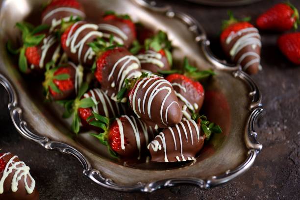 istock Delicious fresh strawberries in milk and white chocolate. 1146246440
