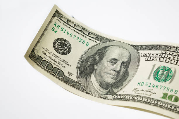 istock Close up hundred dollar banknote on white background 1146247772
