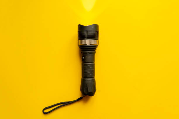 istock steel torch isolated on yellow surface, producing light beams or rays, copy space b 1146250328