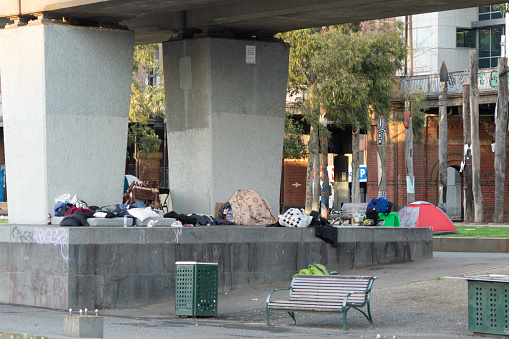 Melbourne, Australia - July 6th 2018: Homeless camp between Flinders Street and the Yarra River