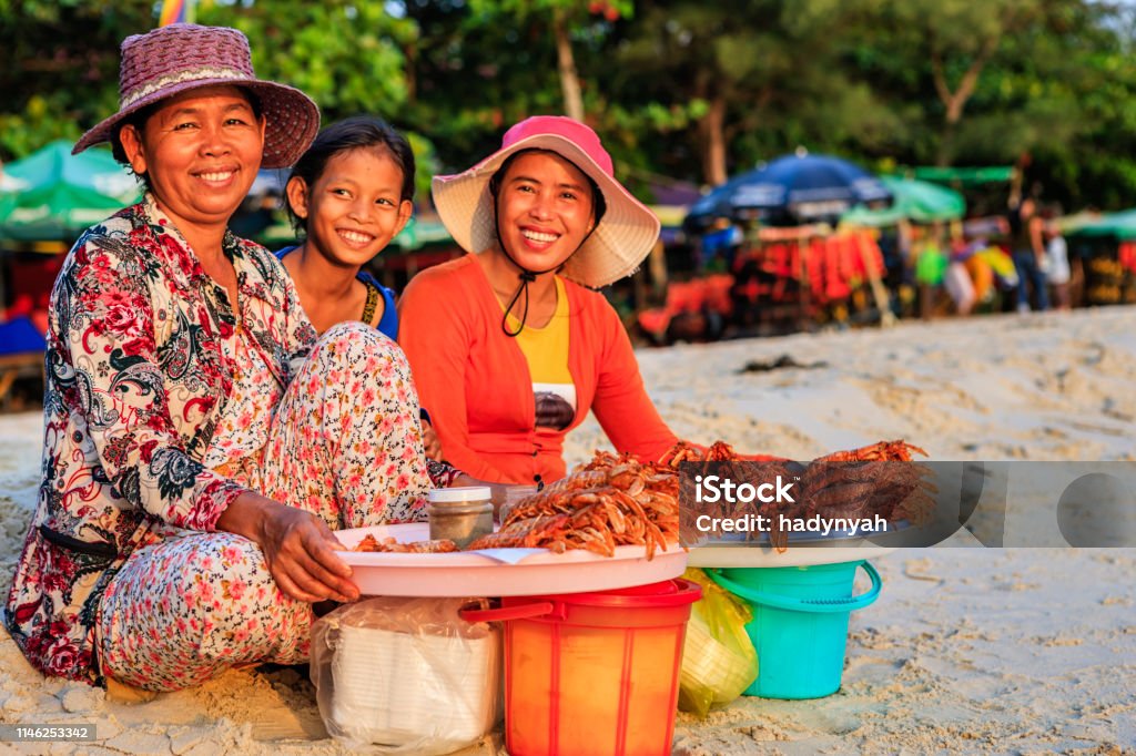 Cambodian women selling fresh lobsters on the beach, Sihanoukville, Cambodia Happy Cambodian women selling fresh lobsters on the beach, Sihanoukville, Cambodia Cambodia Stock Photo