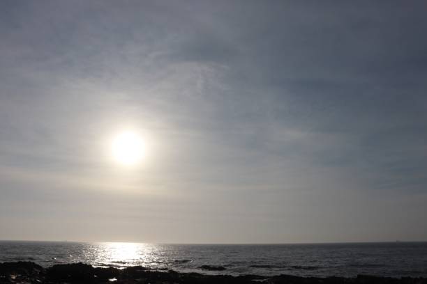 istock Sunrise over rocks and sea 1146256819