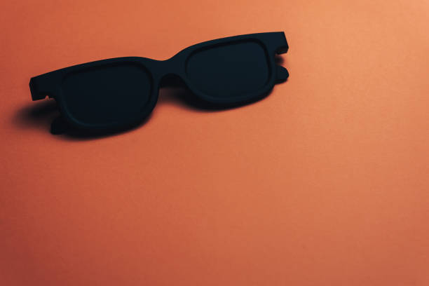 istock Black classic glasses on a Beautiful coral orange background. 1146258105