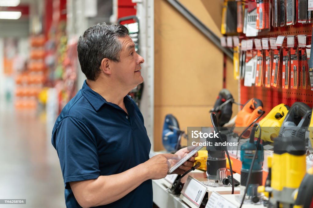 Tool Purchasing Man Buying Tools At A Hardware Store Stock Photo - Download Image Now ...