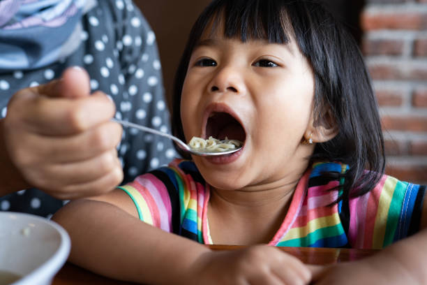 istock muslim mother feed her daughter 1146259160