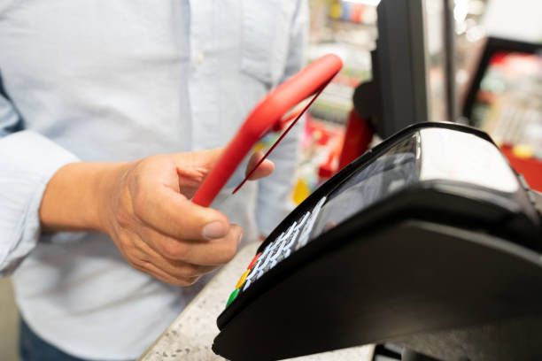 istock Customer making a smart payment at the hardware store using a mobile phone 1146259308