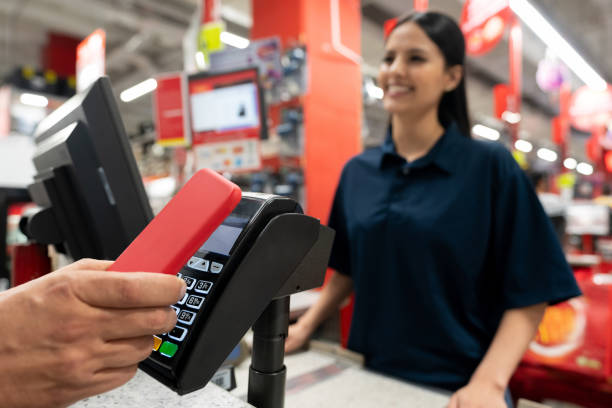 istock Customer making a smart payment at the hardware store using a cell phone 1146259313