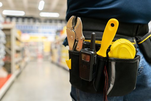 Close-up on a contractor shopping for supplies at a home improvement store
