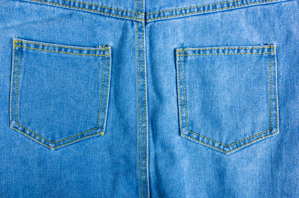 istock Blue washed faded jeans texture with seams 1146260428