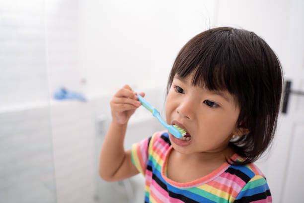 istock toddler independently brush her own teeth 1146260774