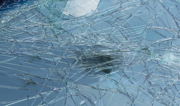 istock broken windshield background and texture. Cracked glass of accident car windows. 1146262038
