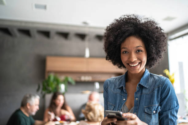 istock Portrait of young woman using cellphone 1146262065