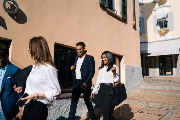istock Business people walk along promenade 1146263133