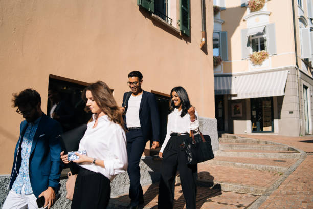 istock Business people walk along promenade 1146263139