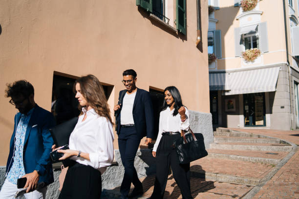 istock Business people walk along promenade 1146263140